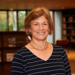 Headshot of Kathy Morris in a library
