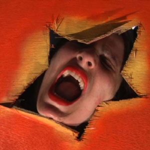 Face with open mouth in star-shaped opening of orange fabric