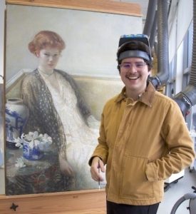 Person in front of a painting